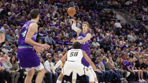 Utah Jazz center Walker Kessler (24) gets past Denver Nuggets center Nikola Jokic (15) and to the basket during the second half at Vivint Arena.
